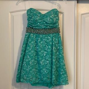 My Michelle homecoming dress from Macys. Size 7. Strapless. Never altered.